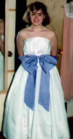 White taffeta prom gown with mauve bow
